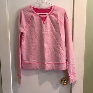 A pink LuluLemon pullover.